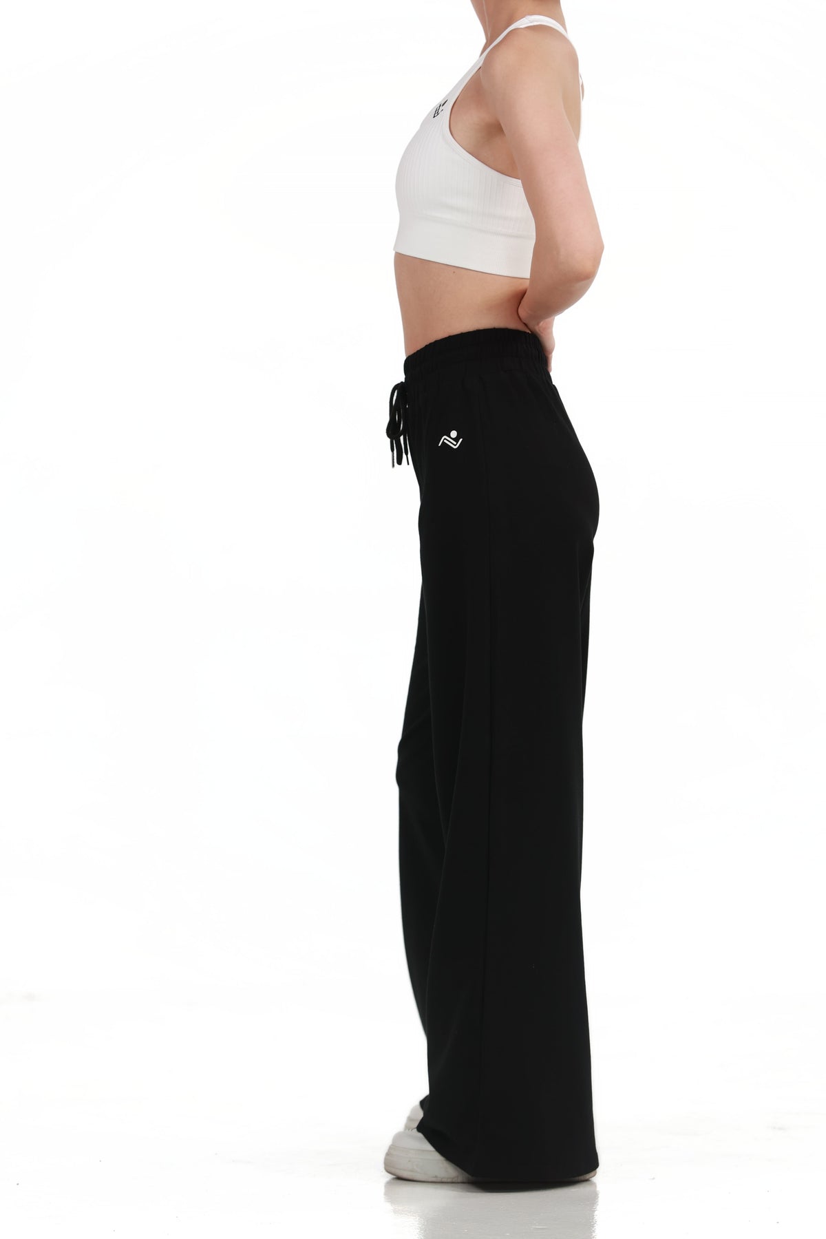 Low Fit Cotton Yoga Pants in Black, full-length front view showing the drawcord waist and wide leg, Ascendia