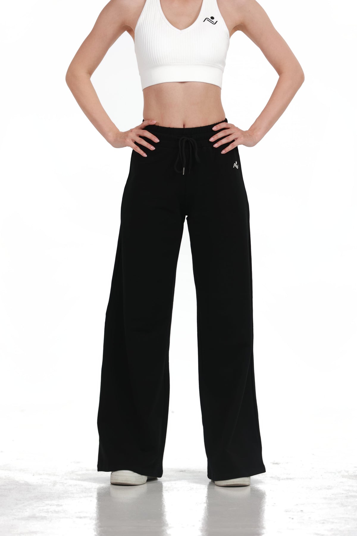 Low Fit Cotton Yoga Pants in Black, back view showing the wide leg and side pockets, Ascendia