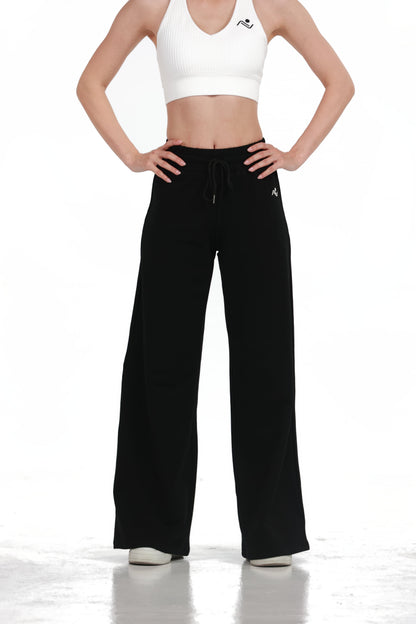 Low Fit Cotton Yoga Pants in Black, back view showing the wide leg and side pockets, Ascendia