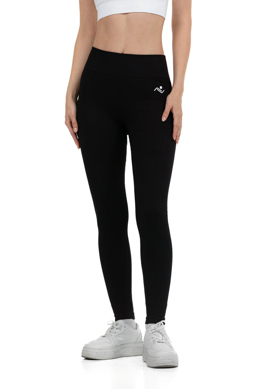 Seamless Lines Leggings in Black, full-length front view showing the ribbed lines and hip logo, Ascendia