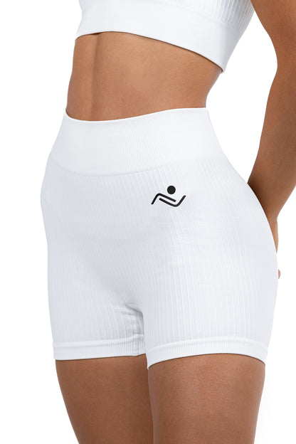 Shape Sculpt Fitness Shorts in White, three-quarter front view showing the ribbed leg, Ascendia
