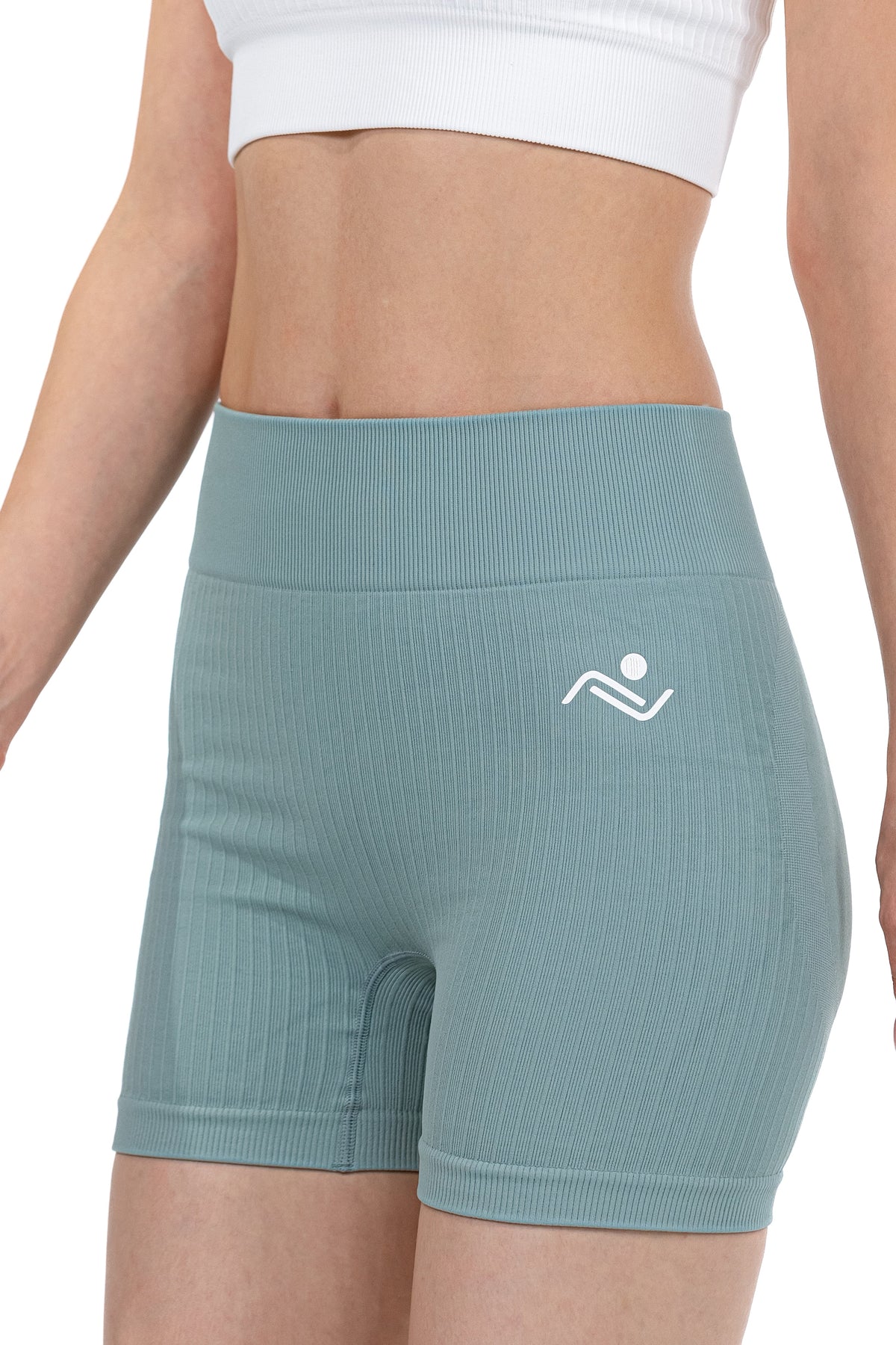Shape Sculpt Fitness Shorts in Sage, three-quarter front view showing the ribbed leg, Ascendia