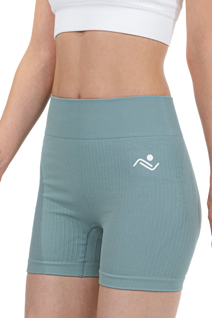 Shape Sculpt Fitness Shorts in Sage, three-quarter front view showing the ribbed leg, Ascendia