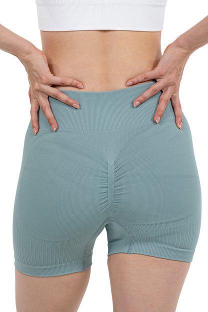 Shape Sculpt Fitness Shorts in Sage, back view showing the ruched seat seam, Ascendia