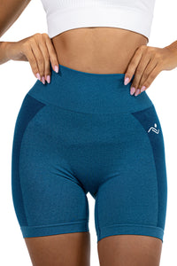 Seamless Ribbed Yoga Shorts in Petrol Blue, front view with hands at the waistband, Ascendia