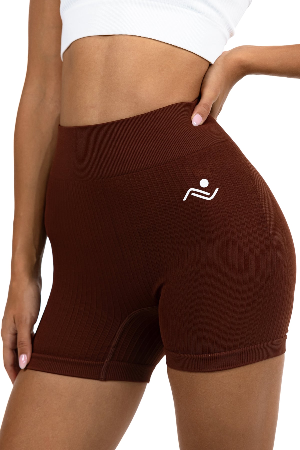 Shape Sculpt Fitness Shorts in Brown, three-quarter front view with a hand at the waistband, Ascendia