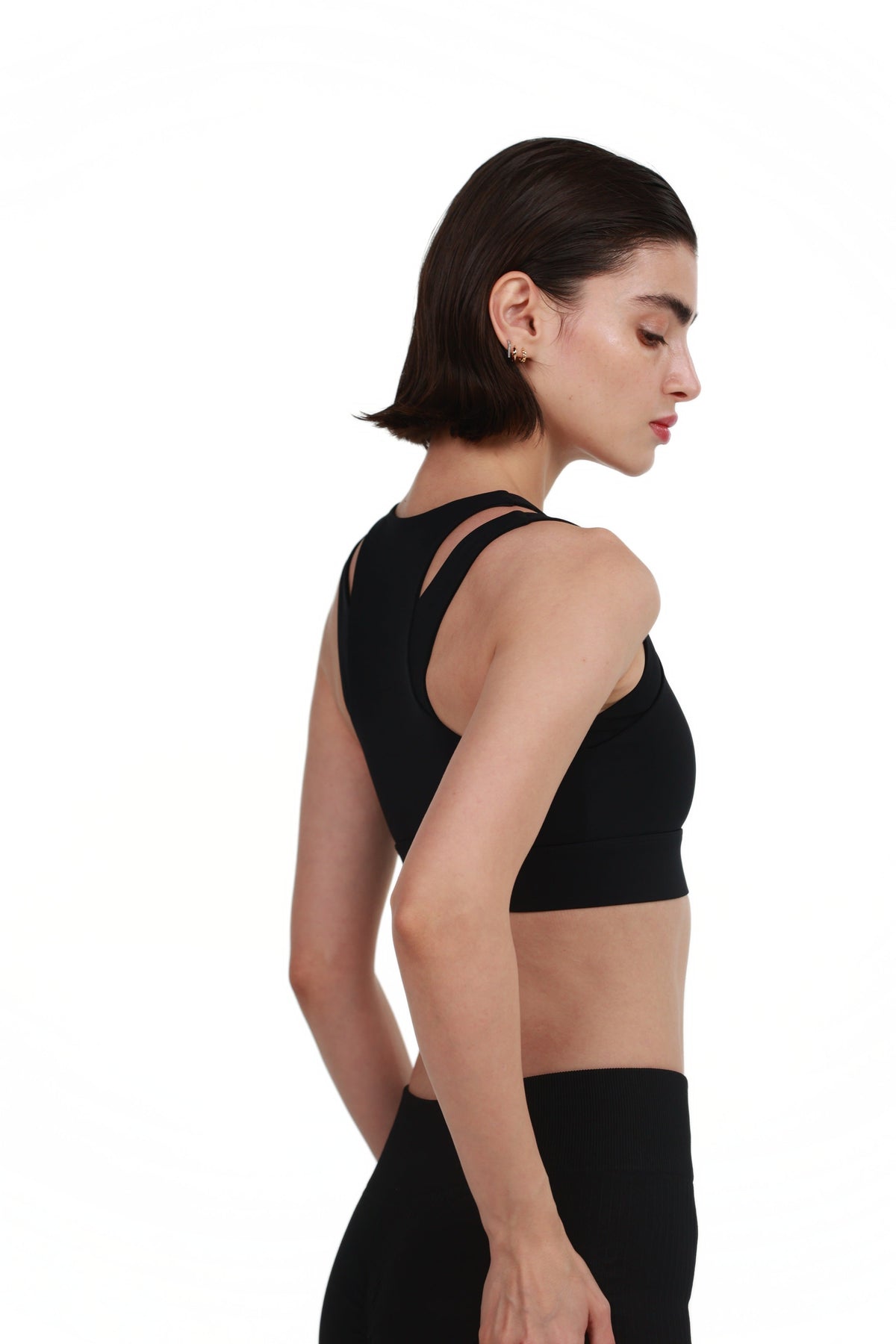 Zip-Front Sports Bra in Black, side view on model, Ascendia