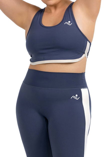 FitFusion Workout Set (XL–4XL) in Slate Blue, detail of the racerback bra and cream side stripe on model, Ascendia