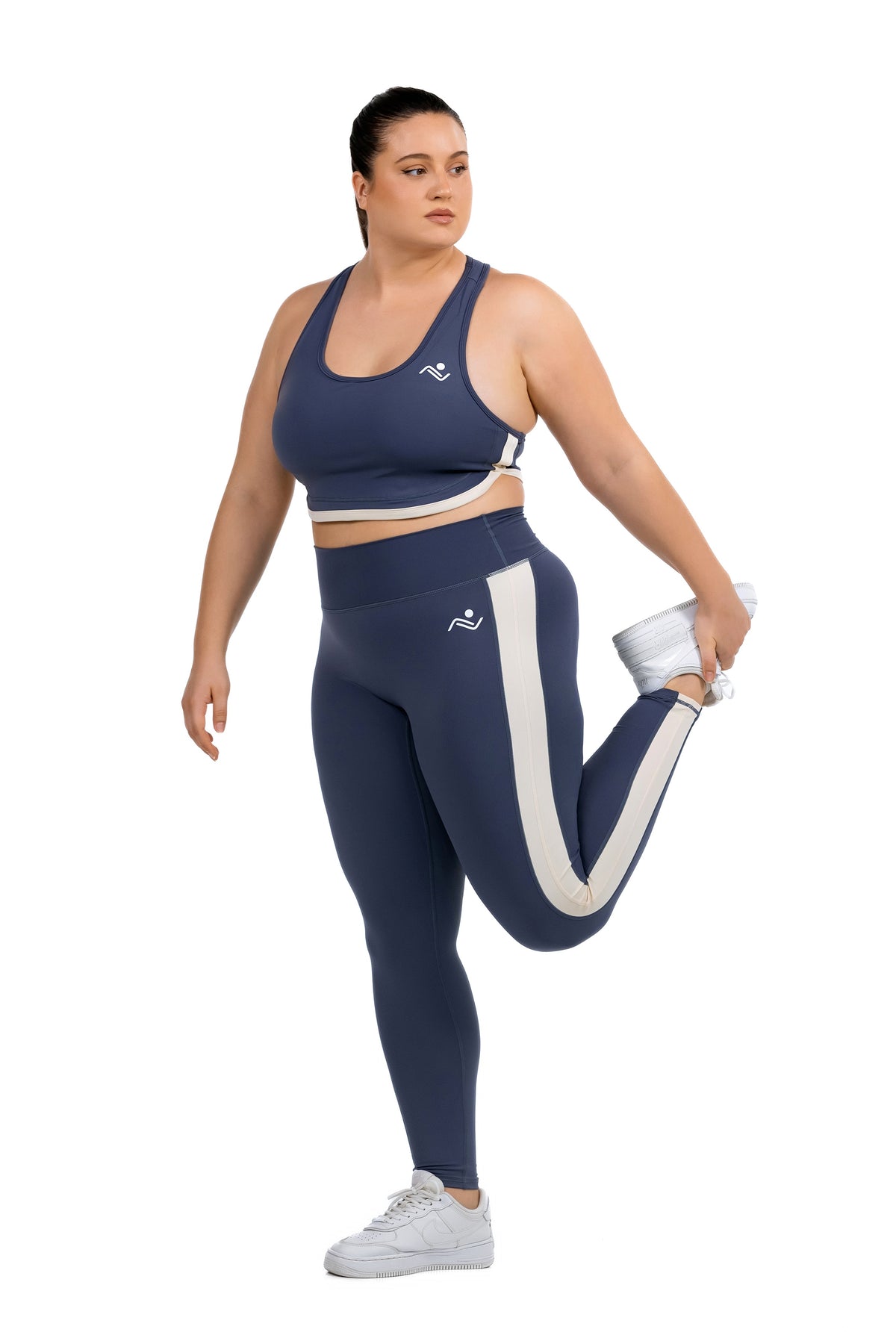FitFusion Workout Set (XL–4XL) in Slate Blue, standing quad stretch on model, Ascendia