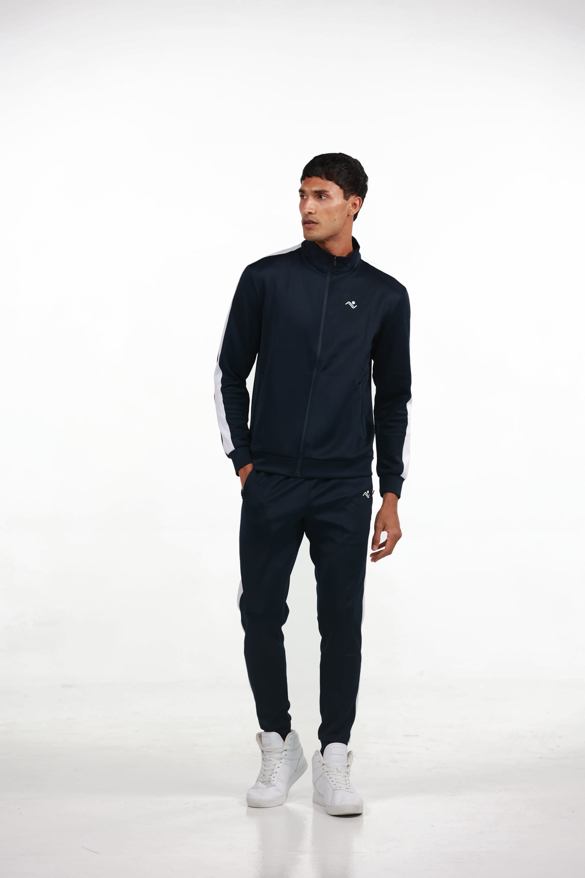 Men's Tracksuit in Blue, full-length front view on model with one hand in the jacket pocket, Ascendia