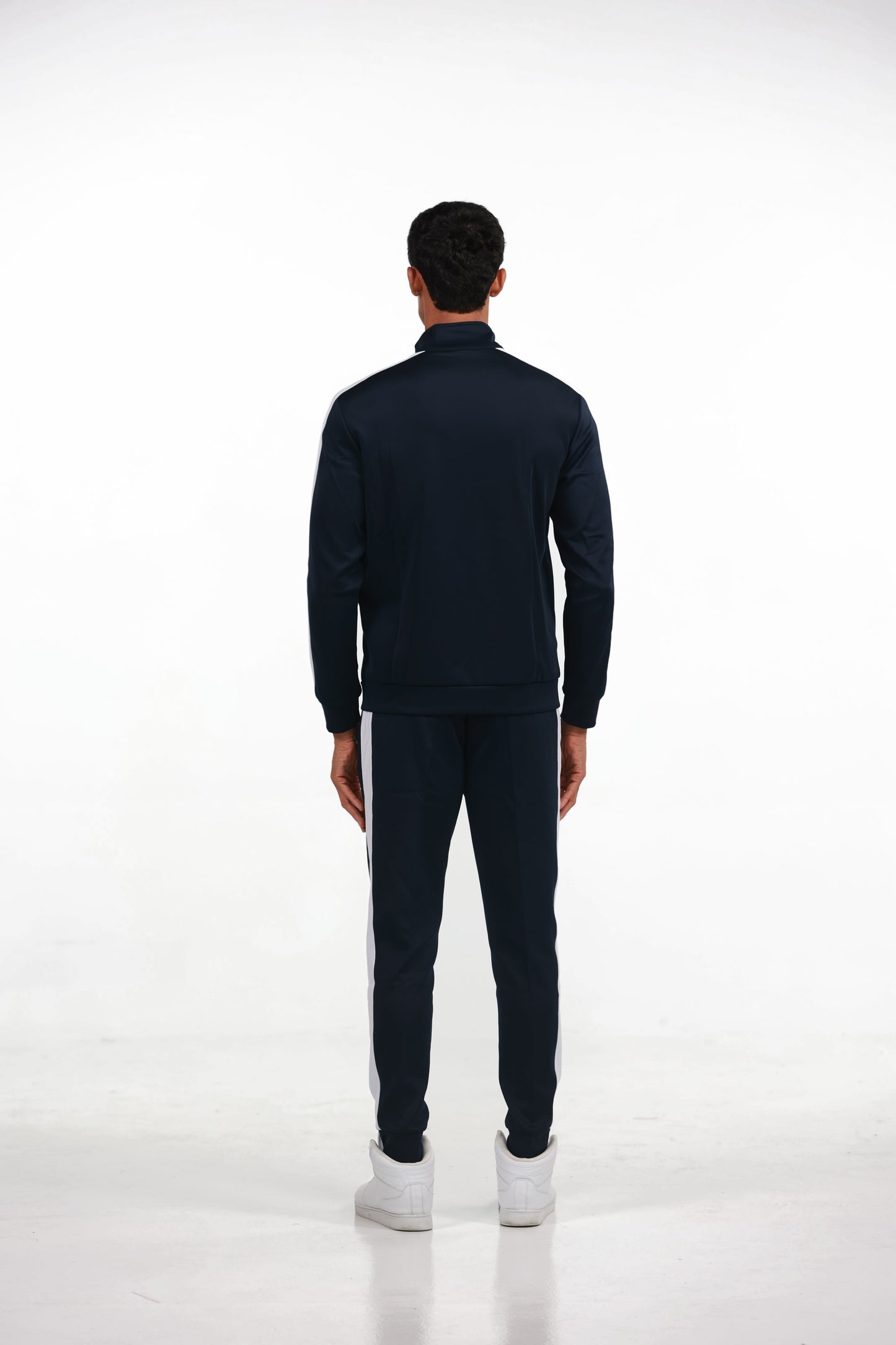 Men's Tracksuit in Blue, full-length back view on model showing the white stripe down the sleeve and leg, Ascendia