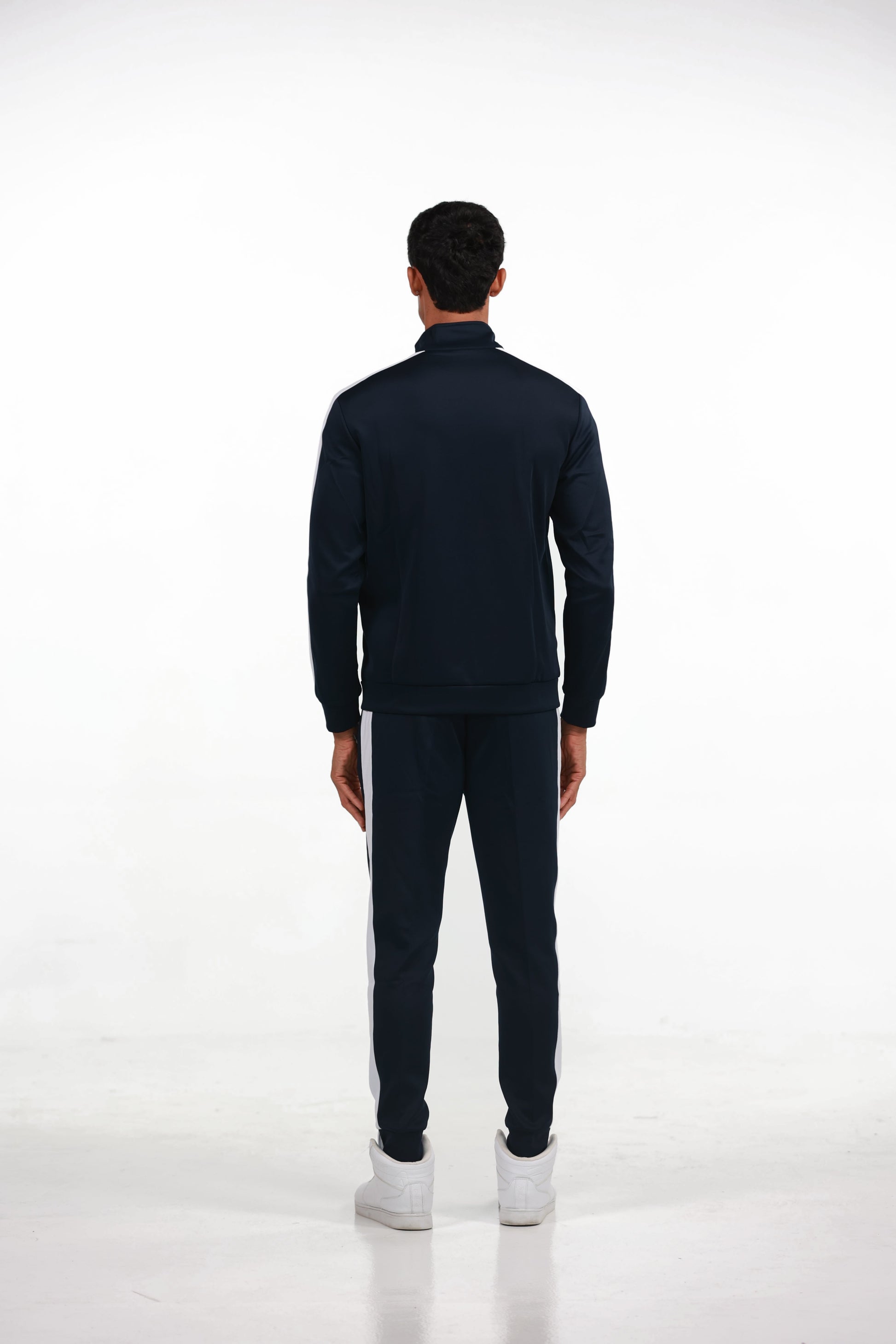 Men's Tracksuit in Blue, full-length back view on model showing the white stripe down the sleeve and leg, Ascendia