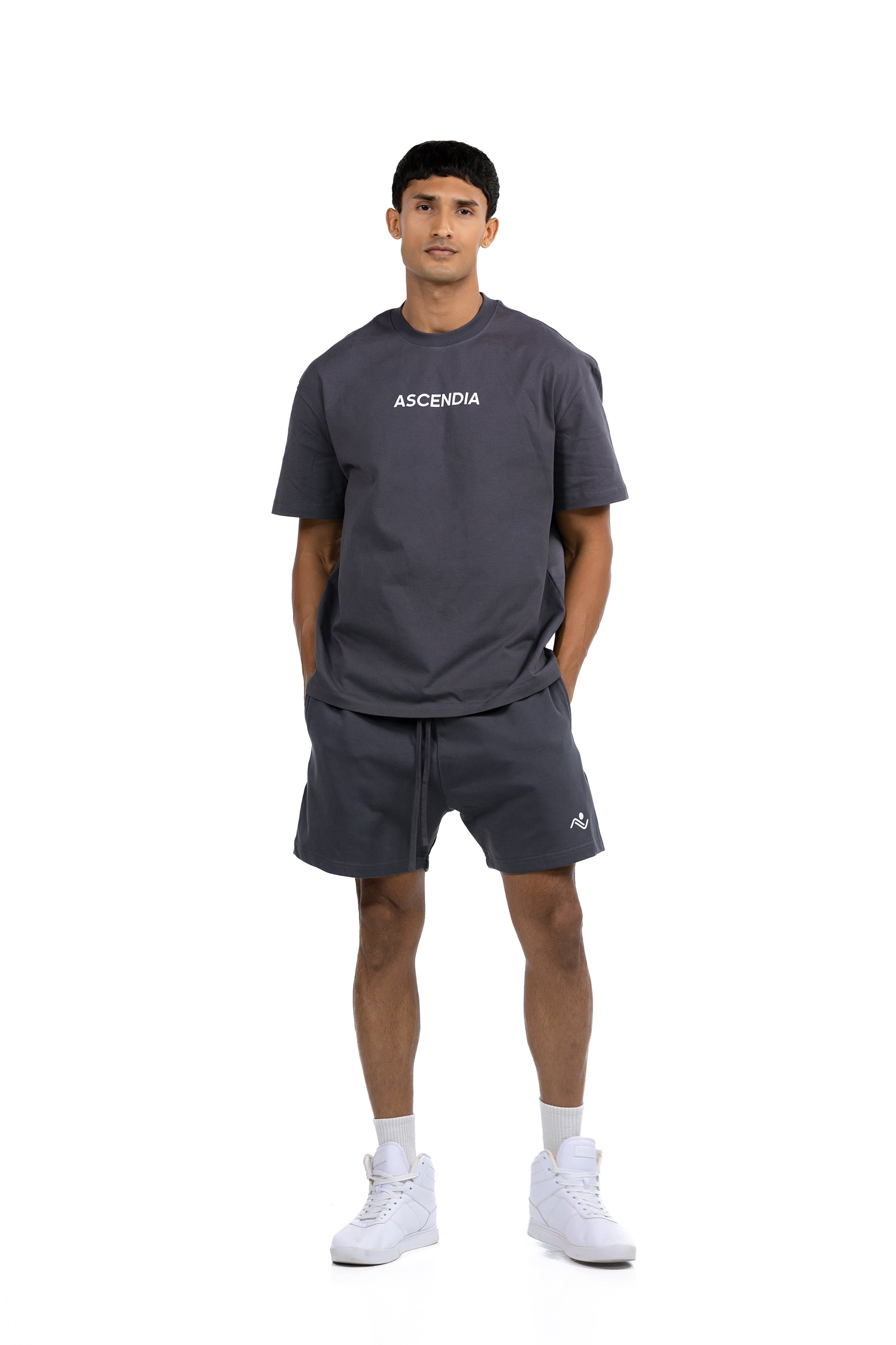 Workout Tee & Short Set in Charcoal, front view on male model with hands in the shorts pockets, Ascendia