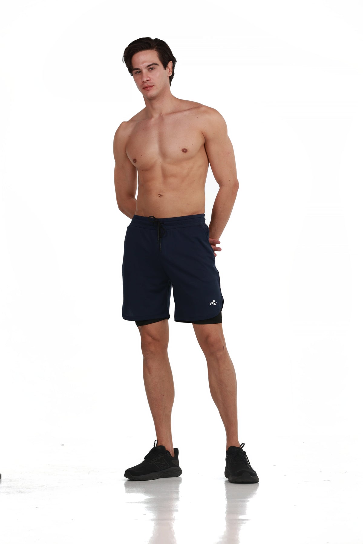 Double Layer Training Shorts in Midnight Navy, full-length front view on model, Ascendia