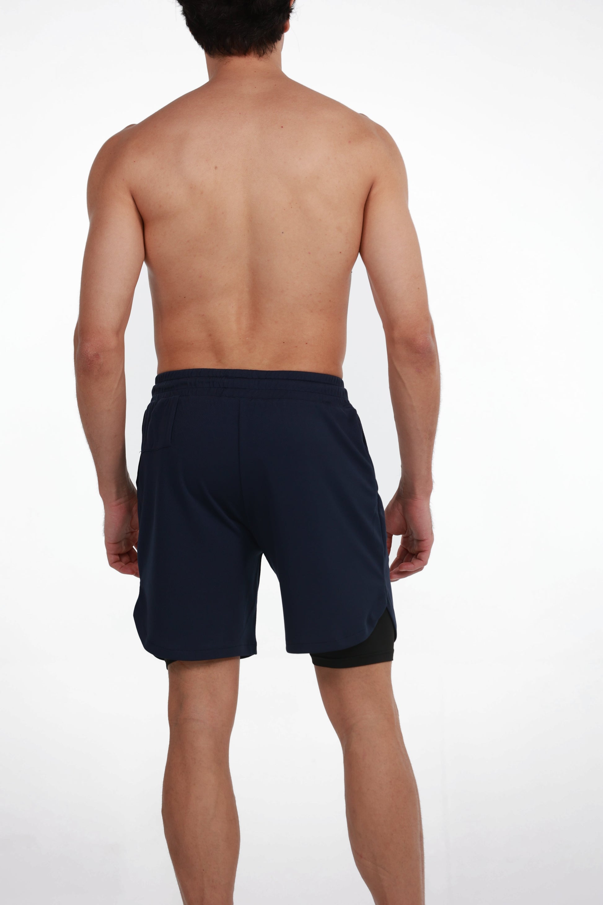 Double Layer Training Shorts in Blue, back view showing the black inner liner below the split hem, Ascendia