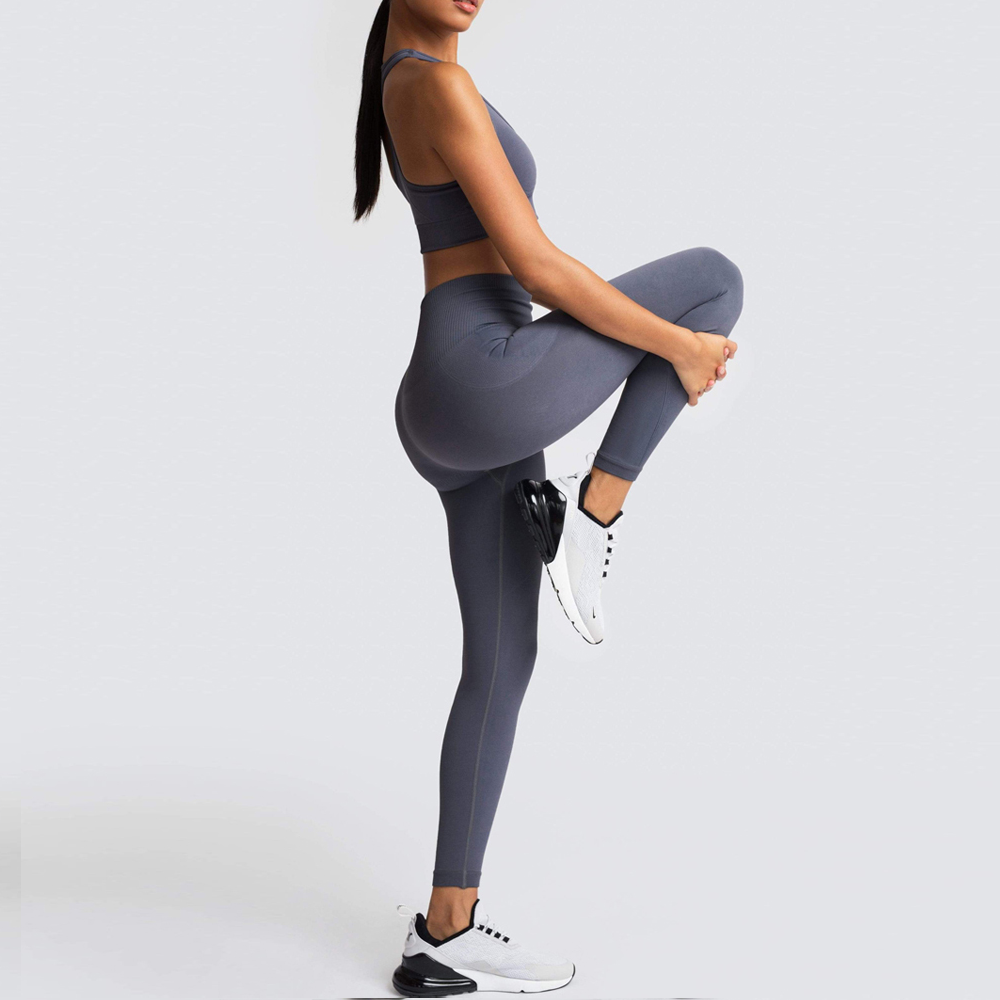 Model demonstrating the leggings' flexibility and style in Grey- ascendiastore