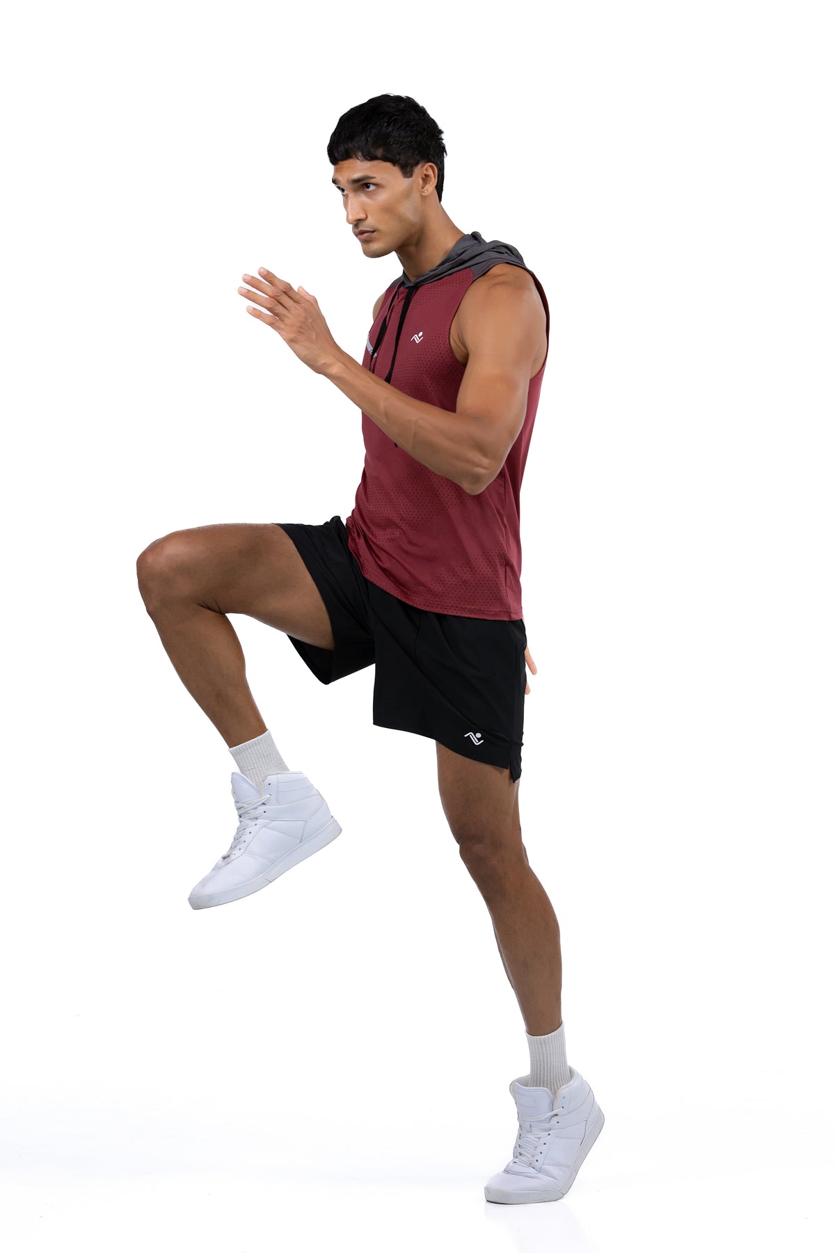Sleeveless Workout Hoodie in Maroon & Charcoal, full length action shot with knee raised, Ascendia