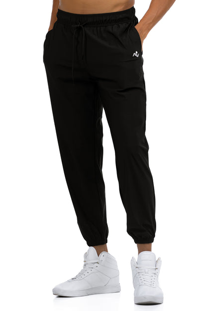 Men's Loose Fit Joggers in Black, front view showing the drawcord waist and ankle cuffs, Ascendia