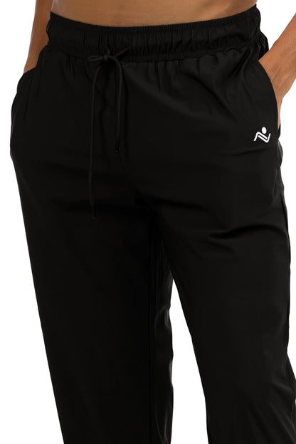 Men's Loose Fit Joggers in Black, close view of the drawcord waistband, side pocket and hip logo, Ascendia