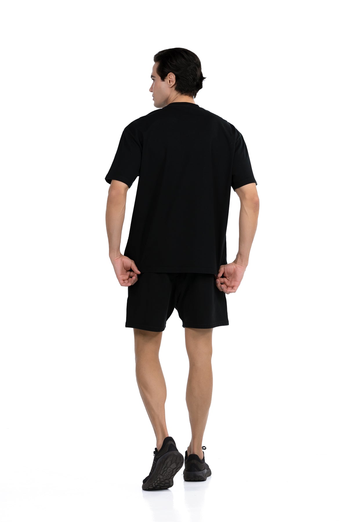 Workout Tee & Short Set in Black, full-length back view on male model, Ascendia