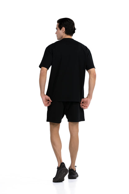 Workout Tee & Short Set in Black, full-length back view on male model, Ascendia