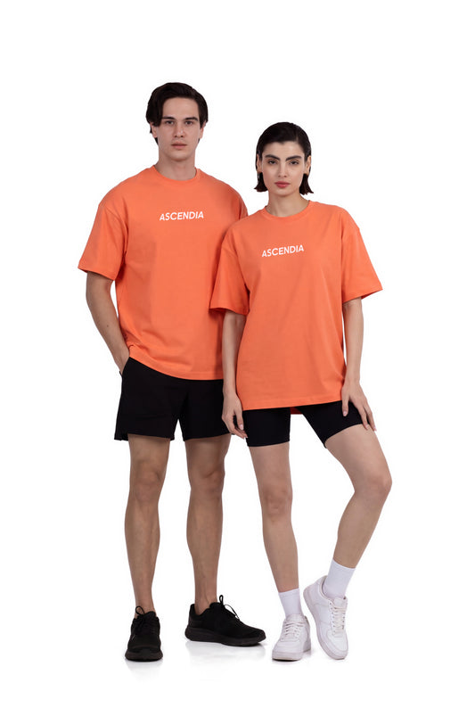 Comfort Oversized T-Shirt in Coral, worn by a man and a woman standing side by side, Ascendia