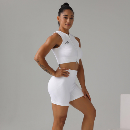 Model confidently striking a pose in the fitness shorts in white - ascendiastore