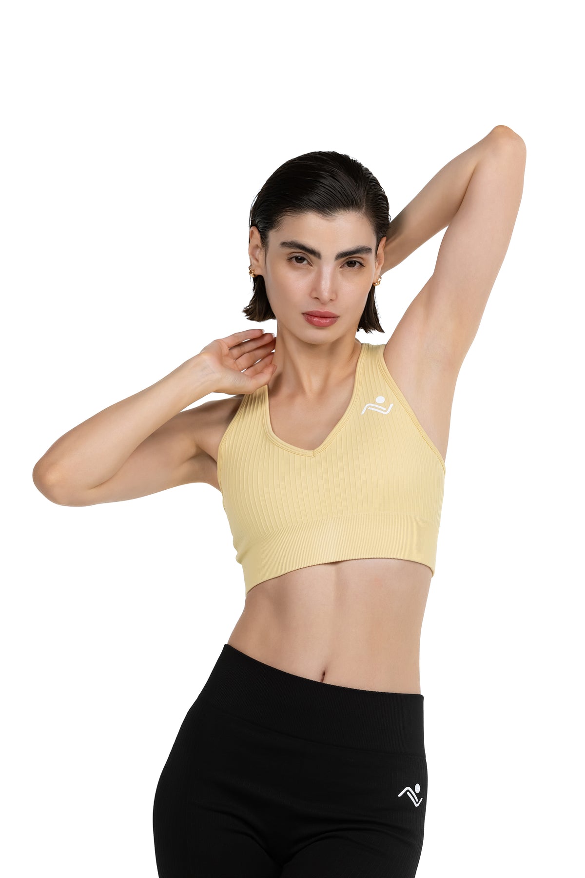 ProFit Athletic Bra in Beige, front view on model with arm raised, Ascendia