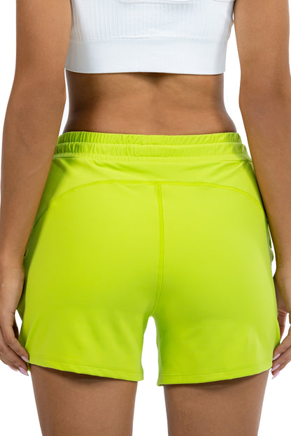 High Waist Running Shorts in Lime, back view on model, Ascendia