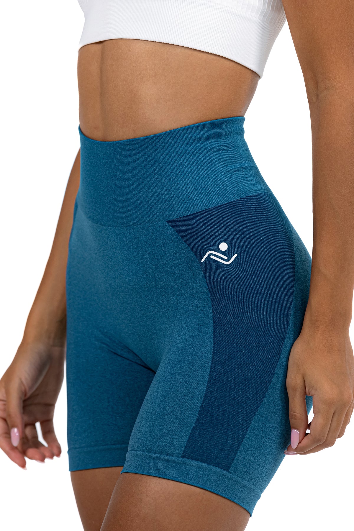 Seamless Ribbed Yoga Shorts in Petrol Blue, three-quarter view showing the hip logo, Ascendia