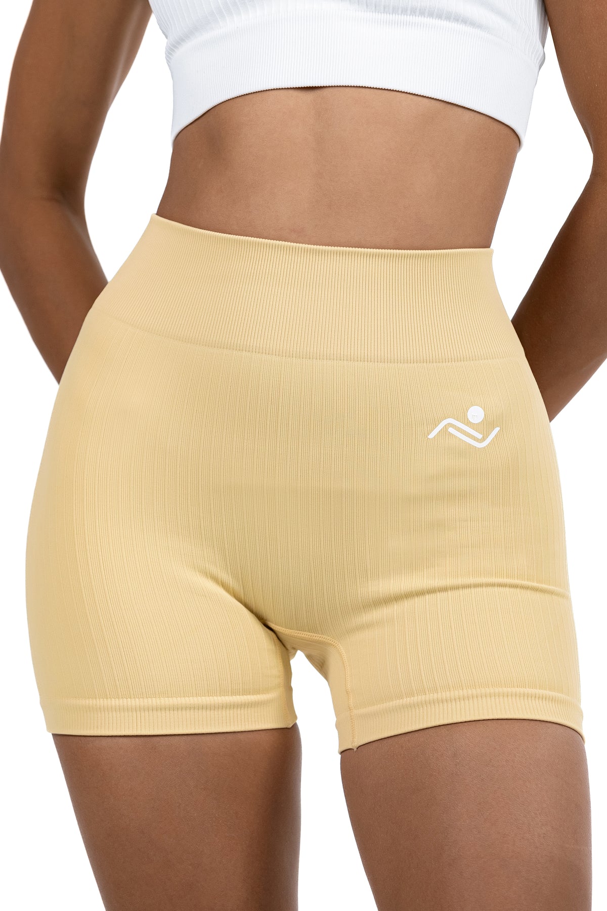 Shape Sculpt Fitness Shorts in Beige, front view showing the ribbed waistband and hip logo, Ascendia