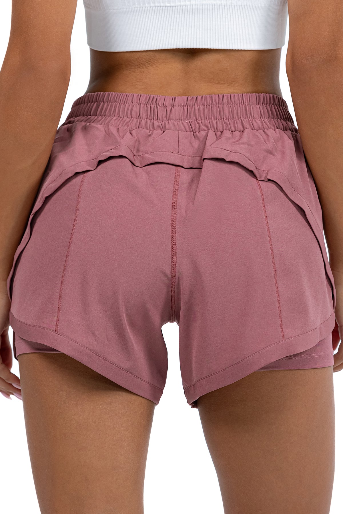 Women's 2-in-1 Running Shorts in Dusty Rose, back view on model, Ascendia