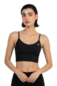 Ribbed Longline Bra in Black, front view on model showing the thin straps and longline hem, Ascendia