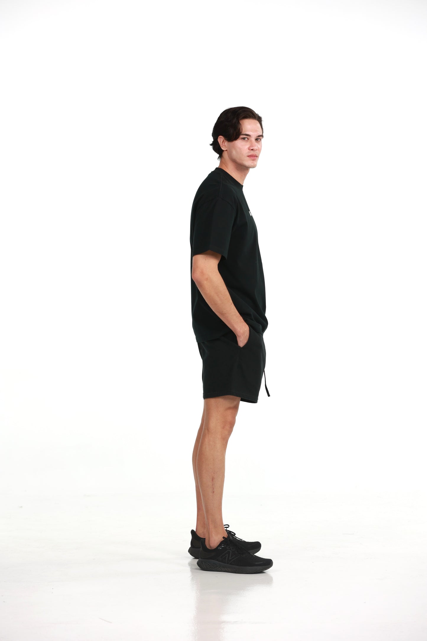 Workout Tee & Short Set in Black, side profile view on male model, Ascendia