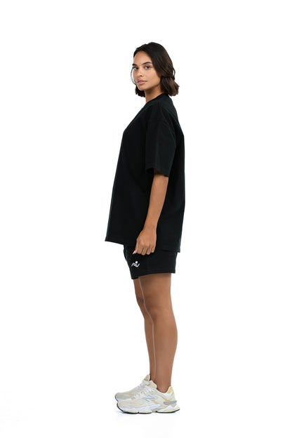 Workout Tee & Short Set in Black, side profile view on female model, Ascendia