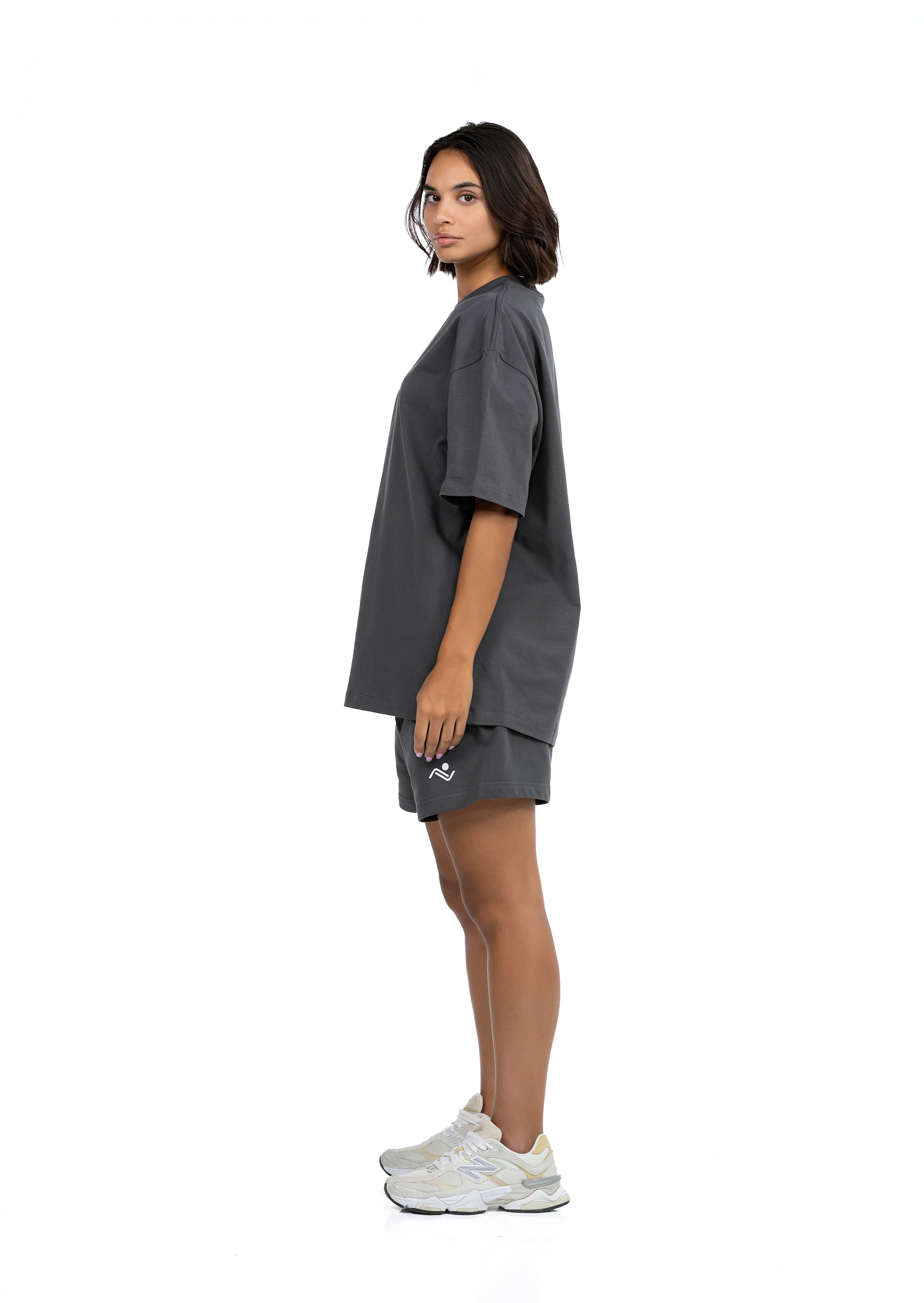 Workout Tee & Short Set in Charcoal, side profile view on female model, Ascendia