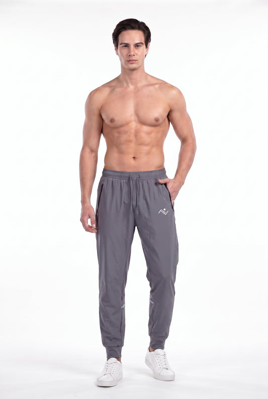 Men's Running Track Pants in gray on male model - front view
