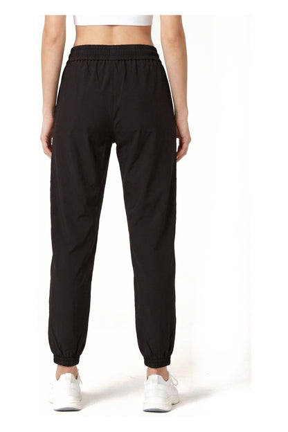Women's Casual Joggers in Black, back view showing the elasticated ankle cuffs, Ascendia