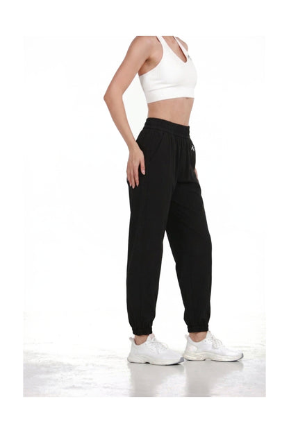 Women's Casual Joggers in Black, side view showing the side pocket and tapered leg, Ascendia