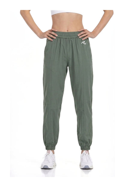 Women's Casual Joggers in Sage, front view on model showing the elastic waist and cuffed ankles, Ascendia