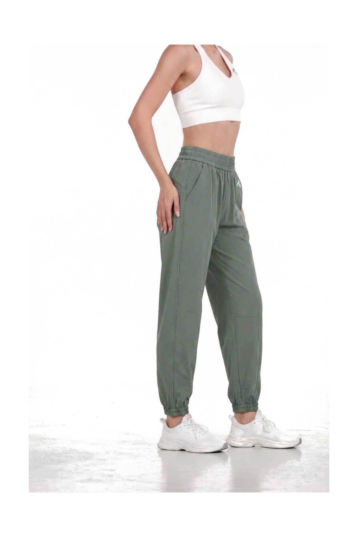 Women's Casual Joggers in Sage, side view showing the side pocket and tapered leg, Ascendia