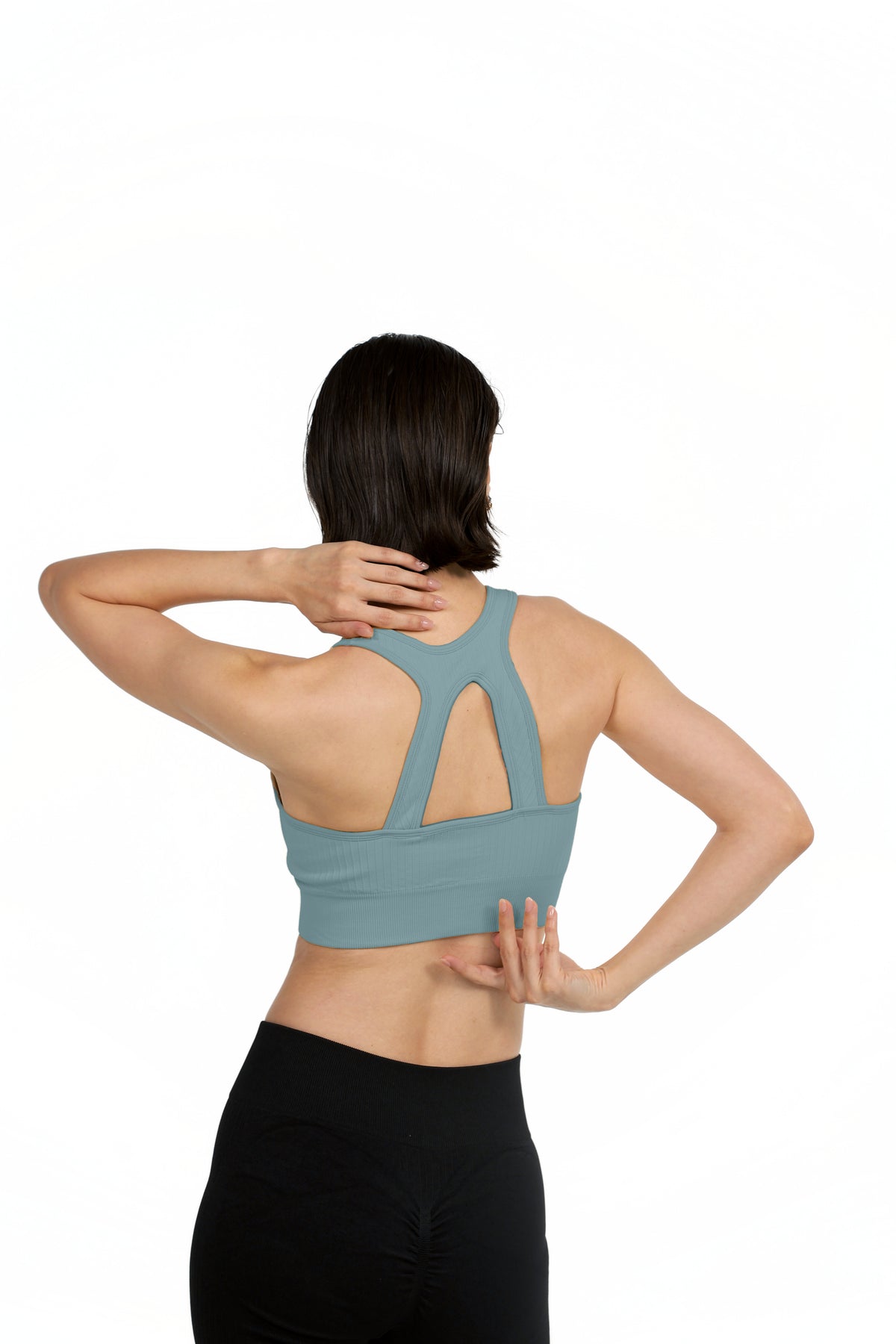 ProFit Athletic Bra in Blue Grey, back view with hands behind the head showing the racerback keyhole, Ascendia
