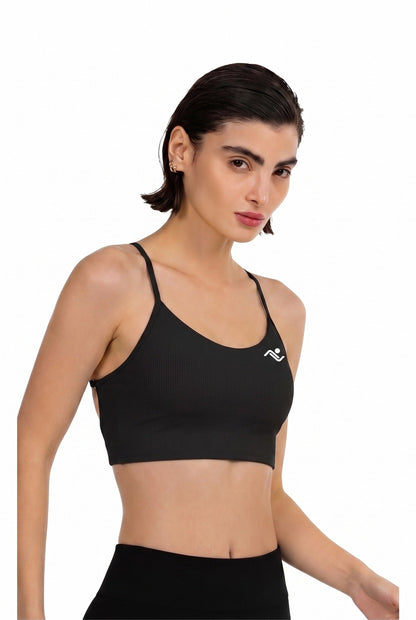 Ribbed Longline Bra in Black, three-quarter view showing the ribbed knit and chest logo, Ascendia